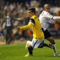 Real Sociedad's Griezmann and Valencia's Feghouli fight for the ball during their Spanish first division soccer match in Valencia