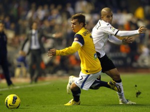 Real Sociedad's Griezmann and Valencia's Feghouli fight for the ball during their Spanish first division soccer match in Valencia